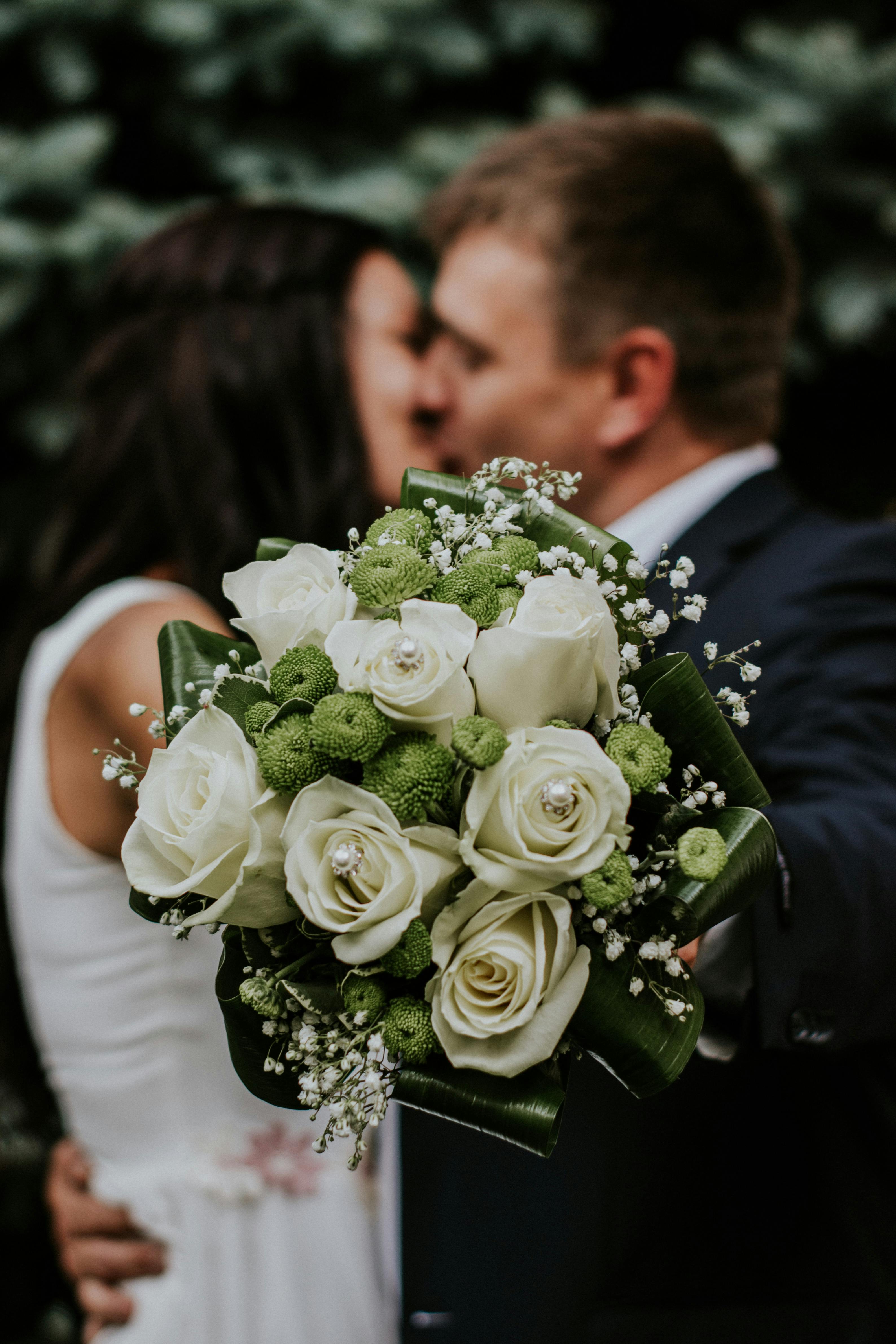Bride and Groom holding bouquet 